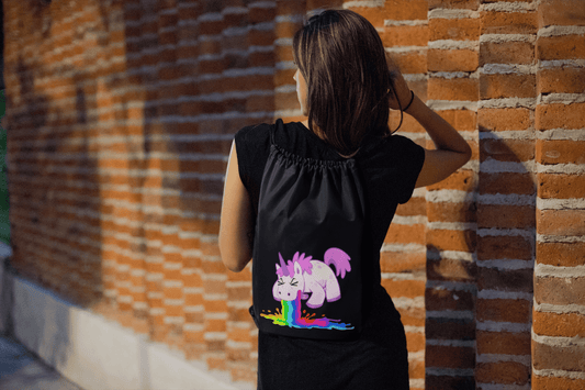 drawstring-bag-mockup-featuring-a-woman-walking-by-a-brick-wall-23670 (1)